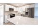Modern kitchen featuring white cabinets, stainless steel appliances, and quartz countertops at 1770 Windsor Dr, Lancaster, SC 29720