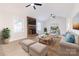Bright living room featuring a brick fireplace, ample seating, and neutral decor, perfect for relaxation at 1770 Windsor Dr, Lancaster, SC 29720
