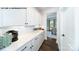 Representative photo showing butler's pantry with white cabinetry and view into dining area at 180 Asmodean Ln, Troutman, NC 28166