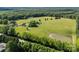 Panoramic aerial view of the estate with lush trees surrounding at 18070 Old Beatty Ford Rd, Gold Hill, NC 28071