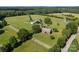 Picturesque farm with red barn, main house, and pond, offering a peaceful retreat at 18070 Old Beatty Ford Rd, Gold Hill, NC 28071