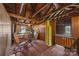 Attic space featuring wooden beams and a mix of chairs and furnishings at 18070 Old Beatty Ford Rd, Gold Hill, NC 28071