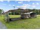 A metal carport sits on a gravel drive with open sides and red trim at 18070 Old Beatty Ford Rd, Gold Hill, NC 28071