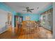 Bright dining room with hardwood floors, ceiling fan, and large window perfect for Gathering meals at 18070 Old Beatty Ford Rd, Gold Hill, NC 28071