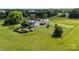 Aerial view of home with above ground pool and outbuildings in a private, rural setting at 18070 Old Beatty Ford Rd, Gold Hill, NC 28071