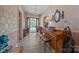 Inviting foyer featuring a vintage chandelier, piano, and view to the home's exterior at 18070 Old Beatty Ford Rd, Gold Hill, NC 28071