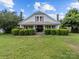 Charming two-story home featuring a covered front porch and meticulously maintained landscaping at 18070 Old Beatty Ford Rd, Gold Hill, NC 28071