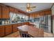 Kitchen featuring wood cabinets, ample counter space, and classic appliances, great for cooking at 18070 Old Beatty Ford Rd, Gold Hill, NC 28071