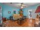 Cozy living room with hardwood floors, a comfortable sofa, and ample seating space at 18070 Old Beatty Ford Rd, Gold Hill, NC 28071