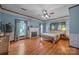 Traditional-style main bedroom featuring a fireplace and hardwood floors at 18070 Old Beatty Ford Rd, Gold Hill, NC 28071