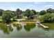Aerial view of lakefront property with private dock and sandy beach access at 2045 10Th Street Nw Ln, Hickory, NC 28601