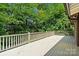 Spacious outdoor deck surrounded by lush greenery, perfect for relaxation at 2045 10Th Street Nw Ln, Hickory, NC 28601