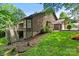 View of a two-story home with wood siding, a deck, and a landscaped backyard at 2045 10Th Street Nw Ln, Hickory, NC 28601