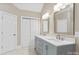 Modern bathroom with a double sink vanity, and a door to an adjacent room at 2045 10Th Street Nw Ln, Hickory, NC 28601