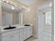 Bathroom with double sink and large mirror at 2045 10Th Street Nw Ln, Hickory, NC 28601