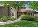 Charming two-story home features a manicured lawn, stone accents, and lush landscaping at 2045 10Th Street Nw Ln, Hickory, NC 28601