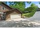 Spacious two-car garage with a paved driveway and beautiful landscaping at 2045 10Th Street Nw Ln, Hickory, NC 28601