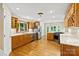 Bright kitchen with stainless steel appliances, wooden cabinets and hardwood floors at 2045 10Th Street Nw Ln, Hickory, NC 28601