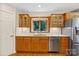 Kitchen area featuring wood cabinets, granite countertops and stainless steel appliances at 2045 10Th Street Nw Ln, Hickory, NC 28601