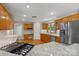 Modern kitchen featuring granite countertops, stainless steel appliances, and wooden cabinetry at 2045 10Th Street Nw Ln, Hickory, NC 28601