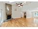 Spacious living room featuring hardwood floors, a stone fireplace, vaulted ceilings, and natural light at 2045 10Th Street Nw Ln, Hickory, NC 28601