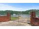 Gated waterfront access point with brick pillars providing secure lake entry at 2045 10Th Street Nw Ln, Hickory, NC 28601