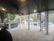 Covered backyard patio featuring a hot tub, spiral staircase, and pool at 208 Stone Ridge Dr, Salisbury, NC 28146