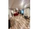 Spacious basement area with hard surface floors and a comfortable seating area at 208 Stone Ridge Dr, Salisbury, NC 28146
