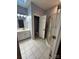Well-lit bathroom with a vanity, toilet, and shower stall with glass door, offering a functional space at 208 Stone Ridge Dr, Salisbury, NC 28146