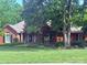 Charming brick home with manicured lawn and mature trees at 208 Stone Ridge Dr, Salisbury, NC 28146