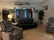 Comfortable living room featuring hardwood floors, plush seating, and tasteful decor for a welcoming atmosphere at 208 Stone Ridge Dr, Salisbury, NC 28146