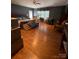 Spacious main bedroom featuring beautiful hardwood floors, a ceiling fan, and large windows at 208 Stone Ridge Dr, Salisbury, NC 28146