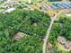 Aerial view showing the home's location surrounded by lush trees and greenery at 218 Point Carpenter Rd, Fort Mill, SC 29707