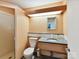 Bathroom featuring a vanity sink with drawers, a toilet, and a walk-in shower at 218 Point Carpenter Rd, Fort Mill, SC 29707
