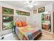 Sunlit bedroom featuring hardwood floors, natural light, and a decorative headboard at 218 Point Carpenter Rd, Fort Mill, SC 29707