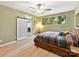 Inviting bedroom boasts an en-suite and a barn door, filled with natural light and wooded views at 218 Point Carpenter Rd, Fort Mill, SC 29707