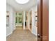 Inviting foyer featuring neutral tile flooring, recessed lighting, and seamless transition into the living spaces at 218 Point Carpenter Rd, Fort Mill, SC 29707