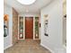 Bright foyer features a stone accent wall, tiled floor, and display niches that add architectural interest at 218 Point Carpenter Rd, Fort Mill, SC 29707