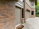 Side door to a brick home with a two-car garage and a gravel walkway at 218 Point Carpenter Rd, Fort Mill, SC 29707