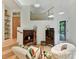 Bright living space with hardwood floors, stylish seating, and ample natural light creating a relaxing ambiance at 218 Point Carpenter Rd, Fort Mill, SC 29707