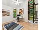 Bright office with a spiral staircase, large windows, and views of the private wooded landscape at 218 Point Carpenter Rd, Fort Mill, SC 29707