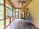 Relaxing screened porch with a hanging chair and views of the lush, private wooded landscape at 218 Point Carpenter Rd, Fort Mill, SC 29707