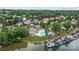 An aerial view of lakefront homes, boat slips, and a community pool at 2444 Mariners Cove Ln, Denver, NC 28037