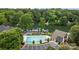 An aerial view featuring a community pool, boat docks, and tree-lined shores at 2444 Mariners Cove Ln, Denver, NC 28037