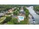 Scenic aerial view of waterfront homes, community pool, and private boat docks at 2444 Mariners Cove Ln, Denver, NC 28037