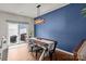 A dining room with access to the backyard, featuring a modern farmhouse table set at 2444 Mariners Cove Ln, Denver, NC 28037