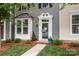 Welcoming front entrance featuring a decorative door frame, well-maintained landscaping, and inviting curb appeal at 2444 Mariners Cove Ln, Denver, NC 28037