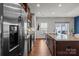 Beautiful kitchen with granite island, stainless steel appliances and wooden cabinets at 2444 Mariners Cove Ln, Denver, NC 28037