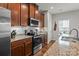 This eat-in kitchen boasts granite countertops, stainless steel appliances, and ample cabinet space at 2444 Mariners Cove Ln, Denver, NC 28037