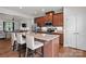 Well-equipped kitchen features an island with seating, ample counter space, and stylish wood cabinets at 2444 Mariners Cove Ln, Denver, NC 28037